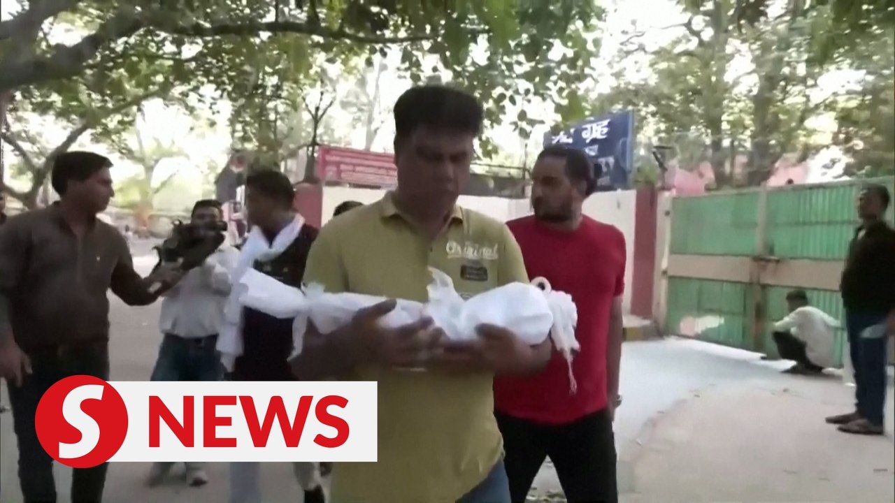 Parents pick up newborns who died in New Delhi fire, as hospital owner ...